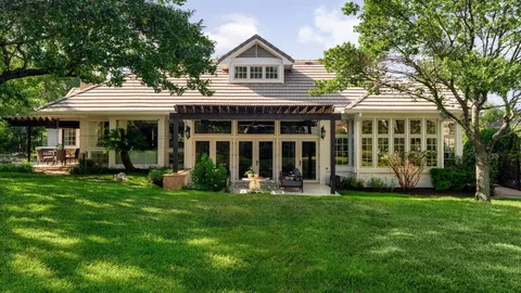 a front view of a house with a yard and porch
