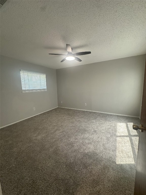 7800 Chimayo Cove, Unit B Austin, TX 78729 - Photo 11 of 17 an empty room with windows and fan