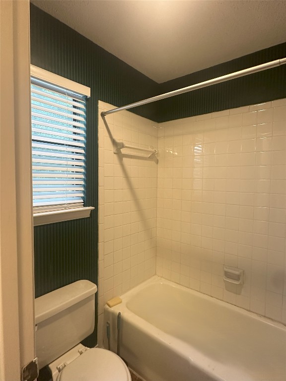 7800 Chimayo Cove, Unit B Austin, TX 78729 - Photo 13 of 17 a bathroom with a bathtub and a shower