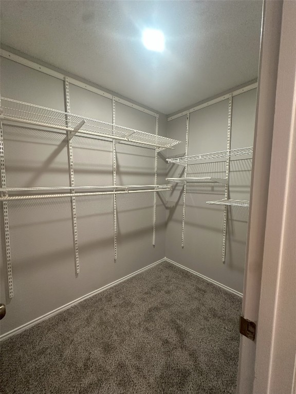 7800 Chimayo Cove, Unit B Austin, TX 78729 - Photo 14 of 17 a view of a room with racks on the wall