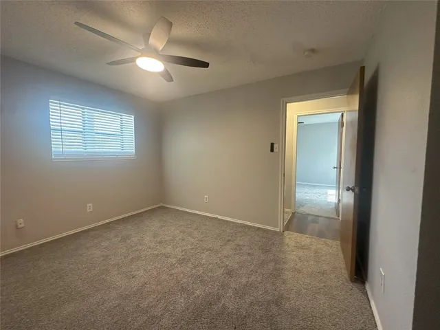 an empty room that has a window in it