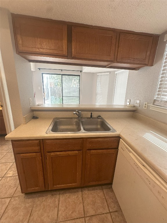 7800 Chimayo Cove, Unit B Austin, TX 78729 - Photo 7 of 17 a utility room with a sink washer and dryer
