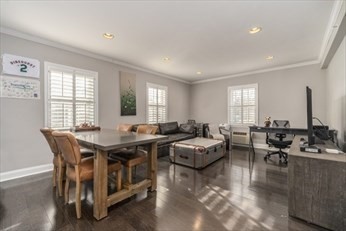 27 Commonwealth Avenue, Unit 1 Newton, MA 02467 - Photo 1 of 12 a view of a dining room with furniture window and wooden floor