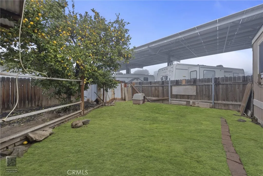 14035 Rosedale Highway, Unit 7 Bakersfield, CA 93301 - Photo 30 of 31 a view of a backyard with wooden fence