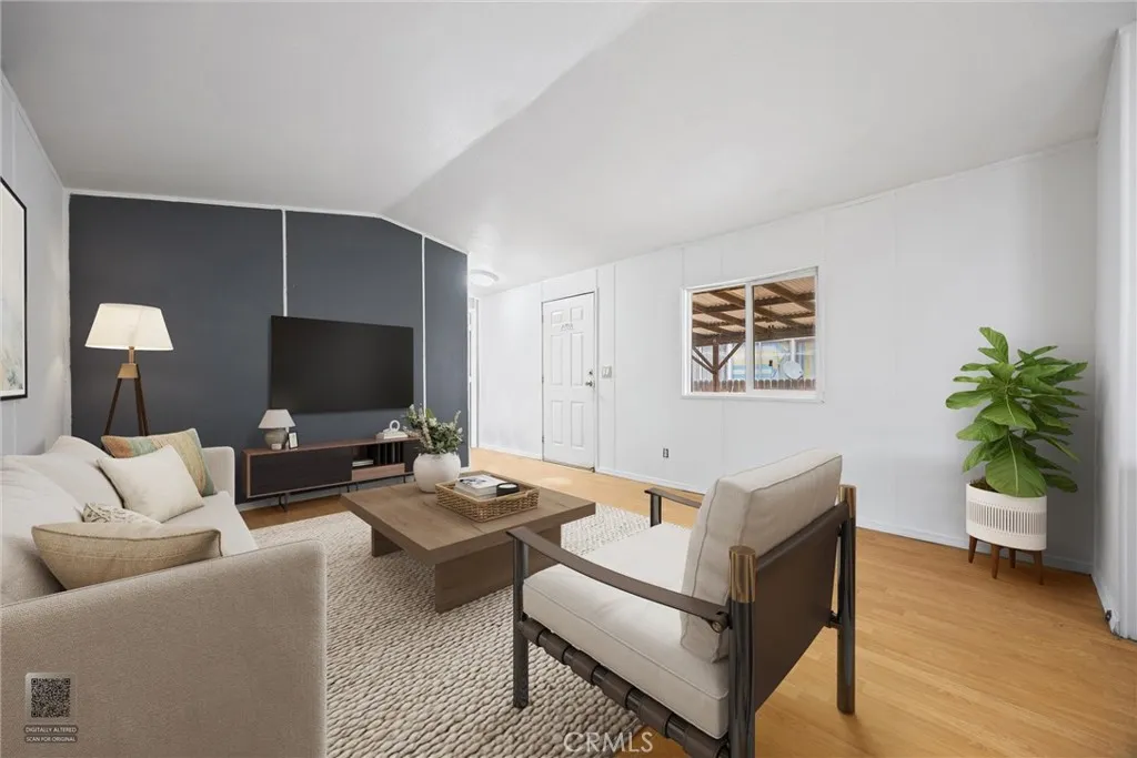 14035 Rosedale Highway, Unit 7 Bakersfield, CA 93301 - Photo 4 of 31 a living room with furniture and a flat screen tv