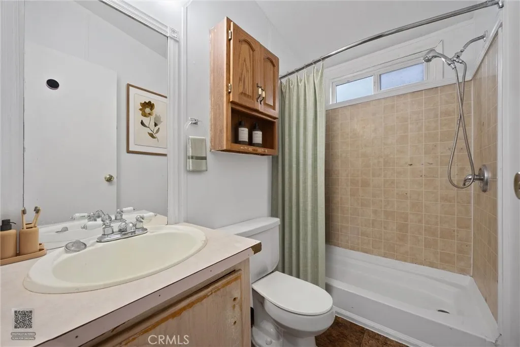 14035 Rosedale Highway, Unit 7 Bakersfield, CA 93301 - Photo 9 of 31 a bathroom with a sink toilet and shower