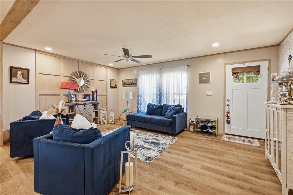 193 Firefly Drive Springtown, TX 76082 - Photo 8 of 32 Open living area featuring wood-finish flooring, recessed lighting, and a ceiling fan
