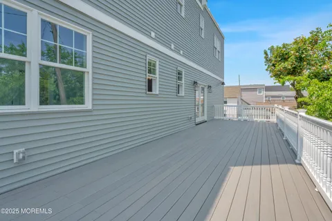 an empty room with a bathroom and a sink