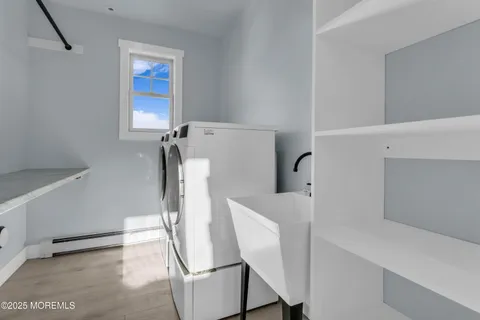 an empty room with window and ceiling fan