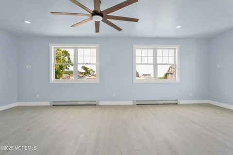 a bathroom with a double vanity sink toilet and bathtub