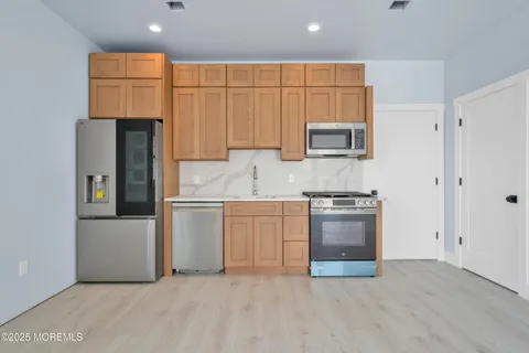 a view of a house with wooden deck