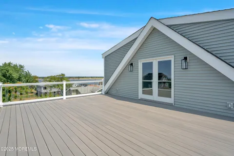 an aerial view of a house with a lake view