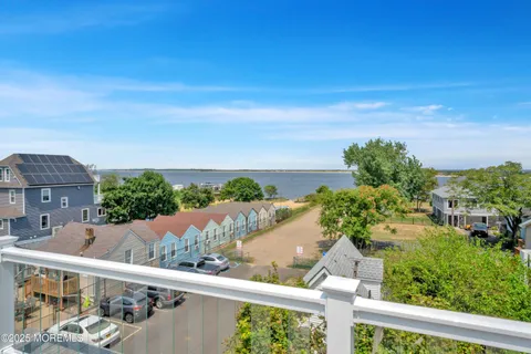 an aerial view of a houses with an outdoor space