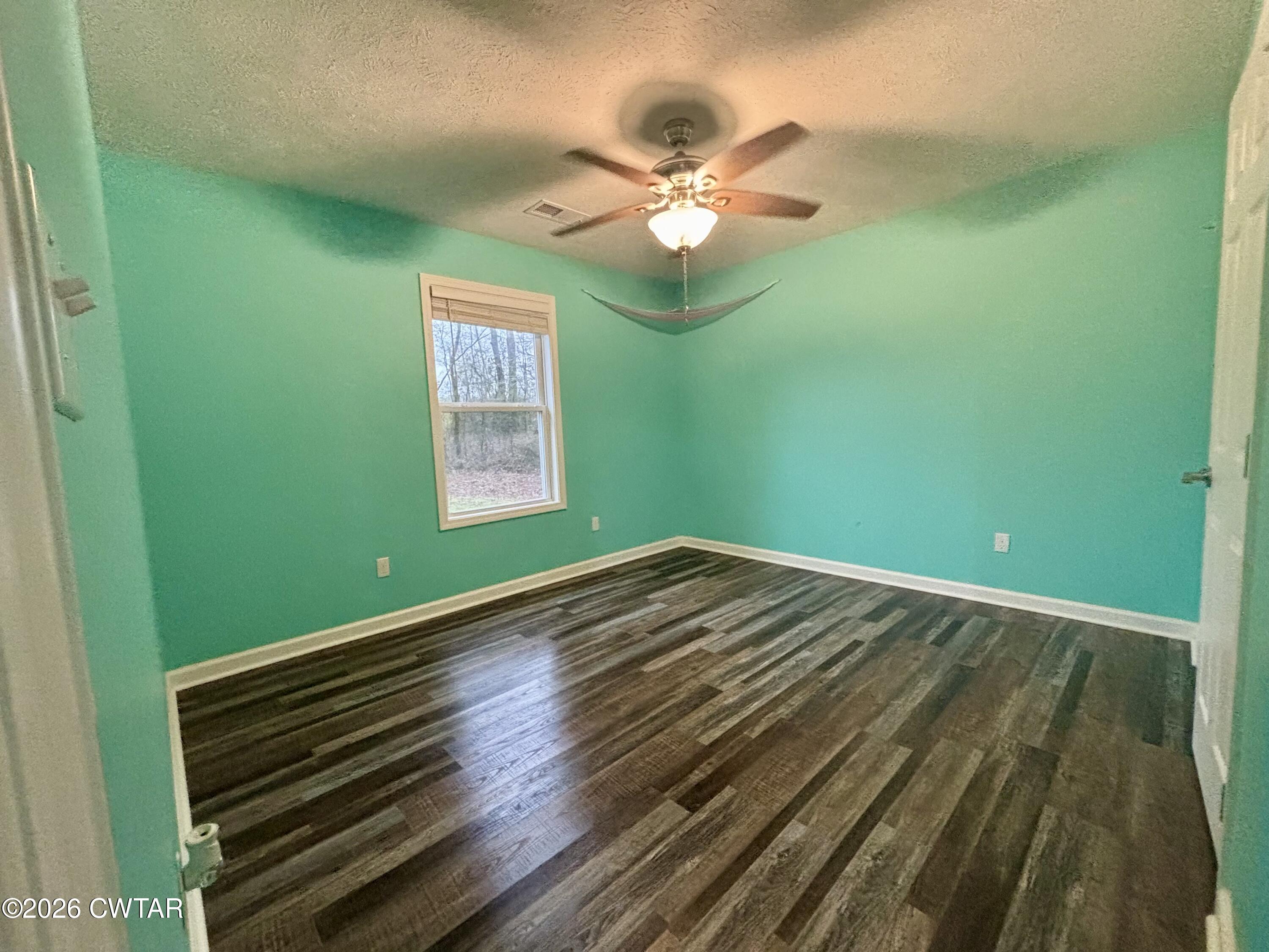 129 Gunner Lane Lexington, TN 38351 - Photo 12 of 19 a view of empty room with window and fan