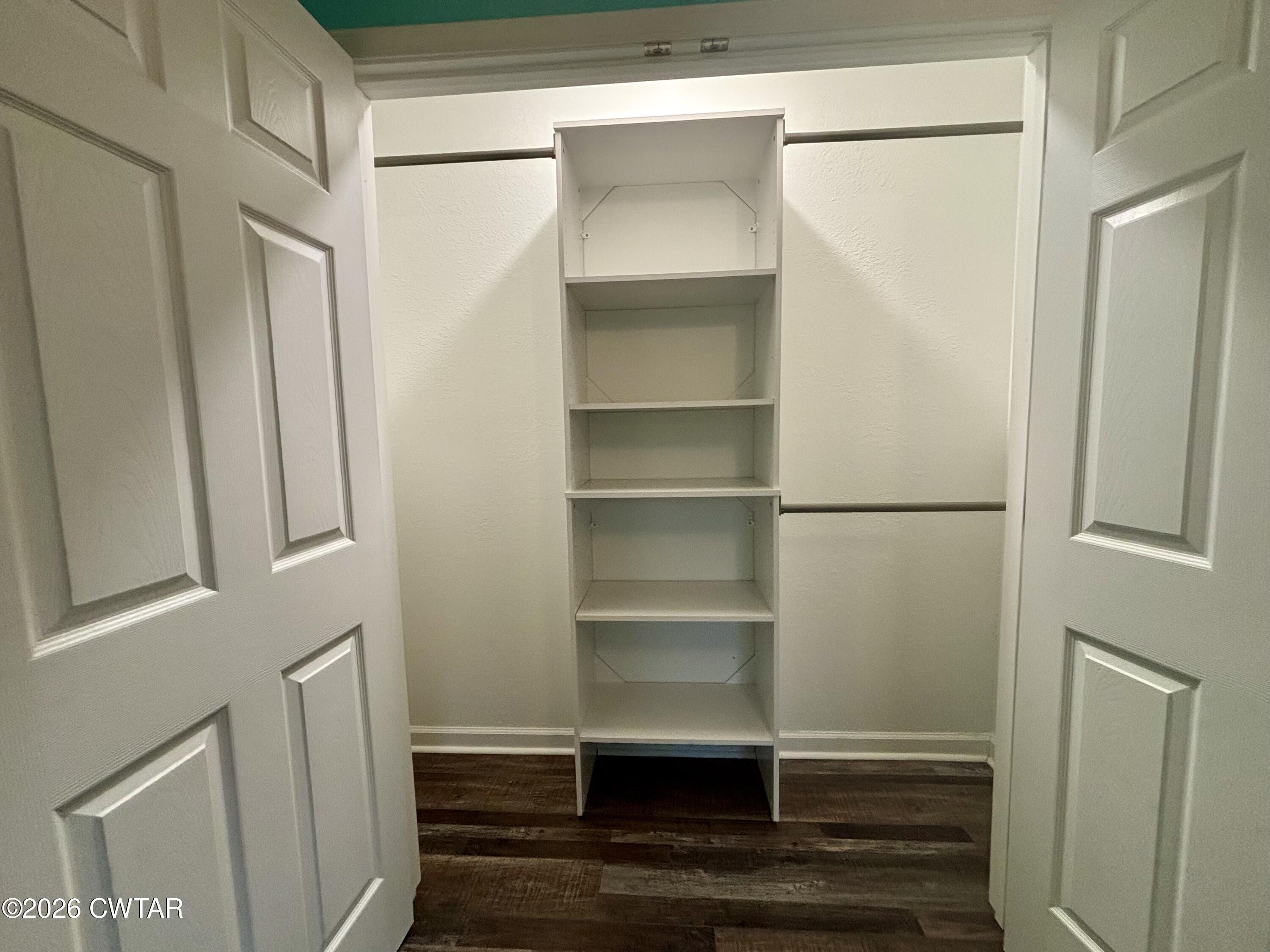 129 Gunner Lane Lexington, TN 38351 - Photo 13 of 19 a view of walk in closet with empty racks