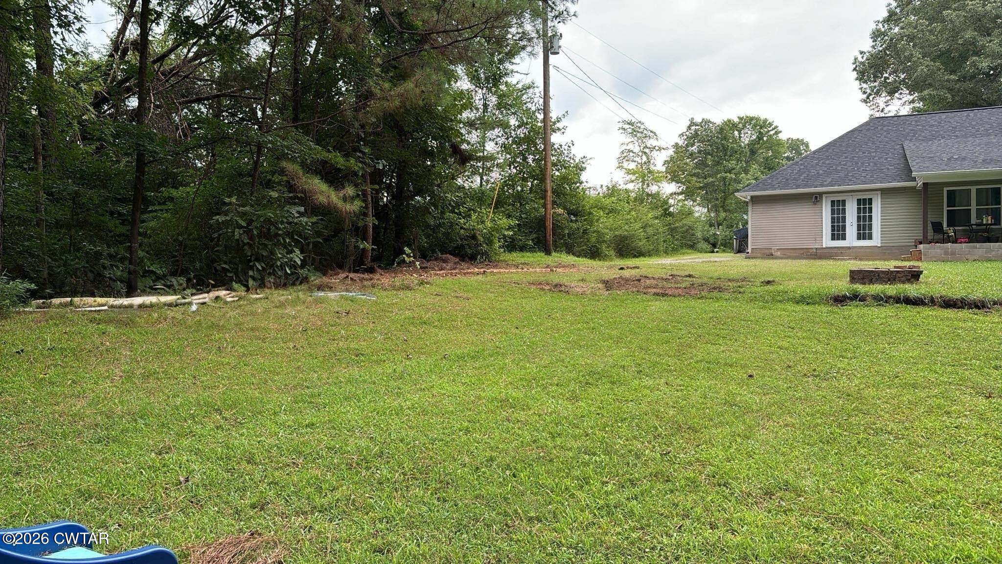 129 Gunner Lane Lexington, TN 38351 - Photo 15 of 19 a view of a house with a big yard