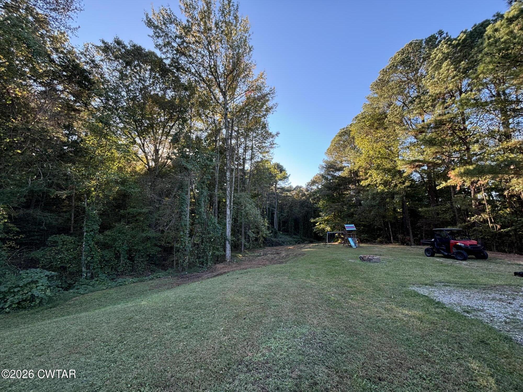 129 Gunner Lane Lexington, TN 38351 - Photo 18 of 19 a view of outdoor space with trees all around