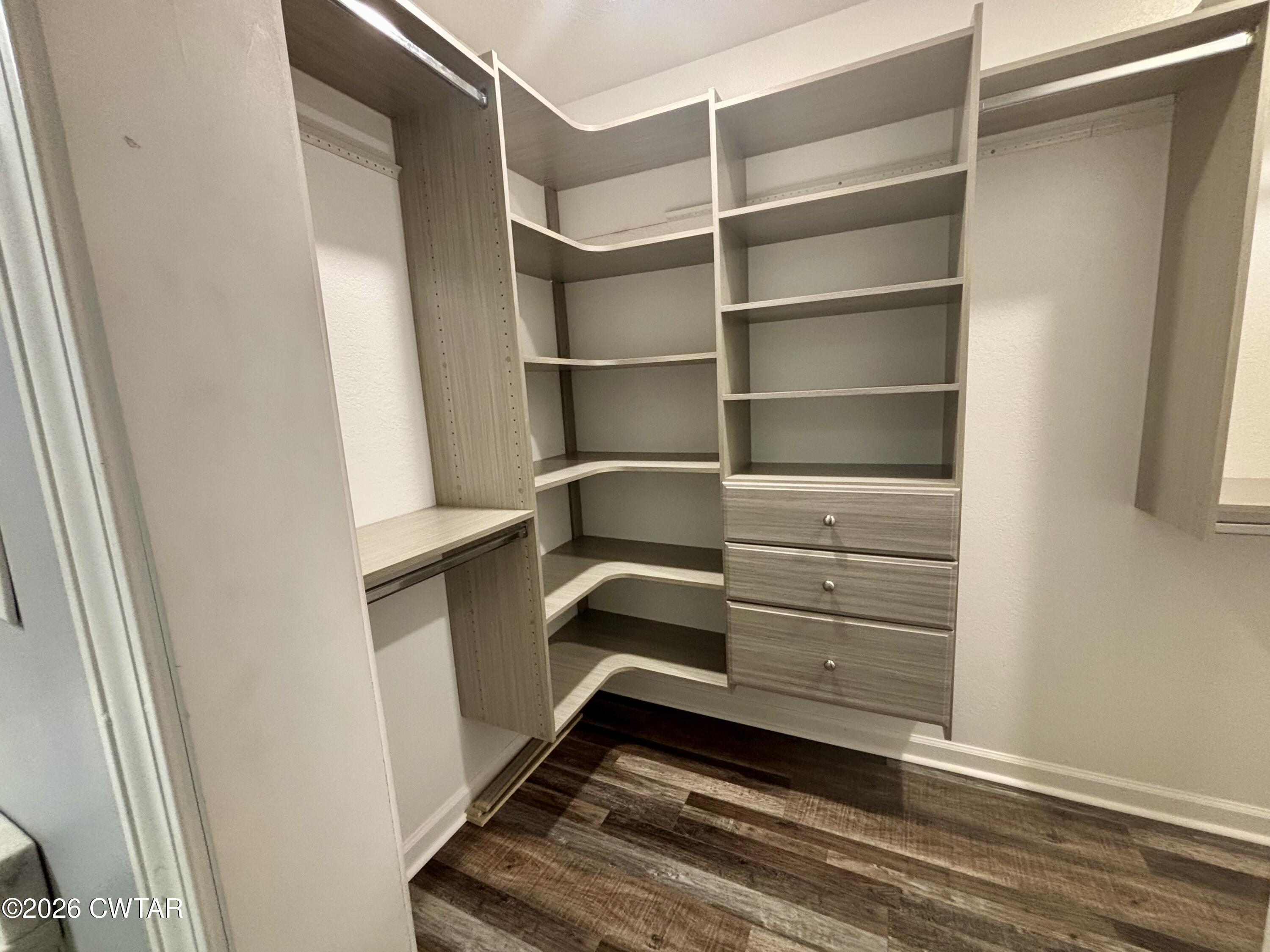 129 Gunner Lane Lexington, TN 38351 - Photo 9 of 19 a storage room with wooden floor