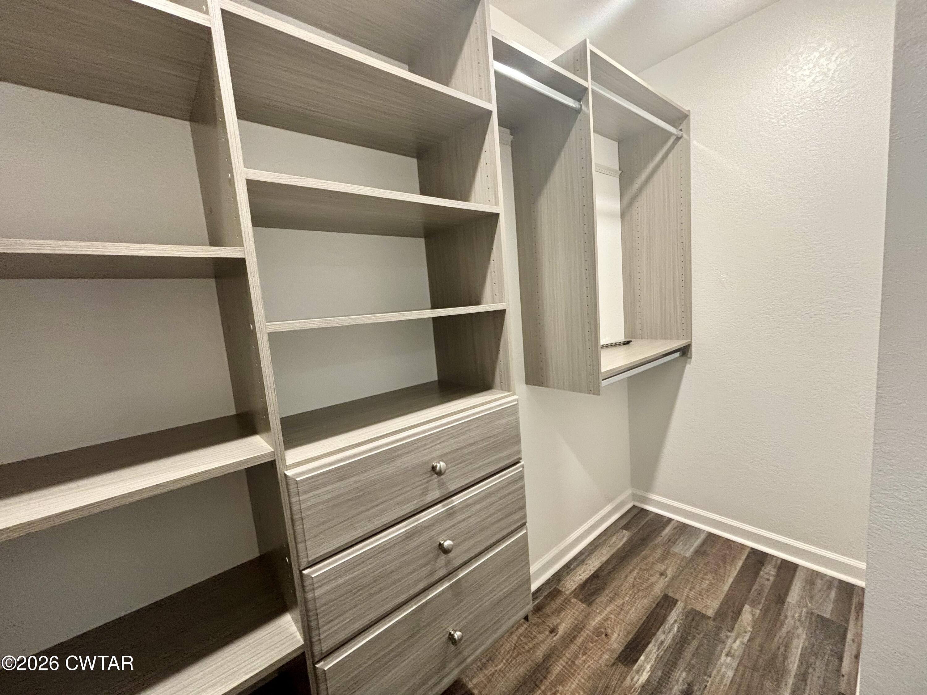 129 Gunner Lane Lexington, TN 38351 - Photo 10 of 19 a view of walk in closet with empty racks