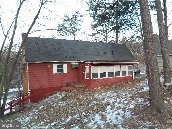 143 Holiday Road Cross Junction, VA 22625 - Photo 2 of 22 a front view of a house with a garden