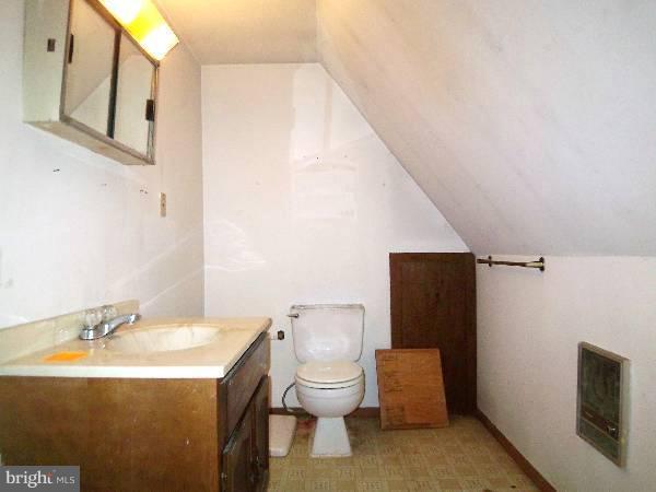 143 Holiday Road Cross Junction, VA 22625 - Photo 4 of 22 a bathroom with a sink and toilet