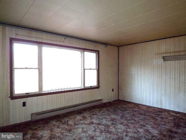 143 Holiday Road Cross Junction, VA 22625 - Photo 6 of 22 a view of an empty room and a window