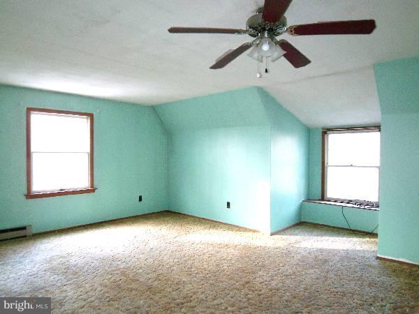 143 Holiday Road Cross Junction, VA 22625 - Photo 7 of 22 an empty room with a window and a fan