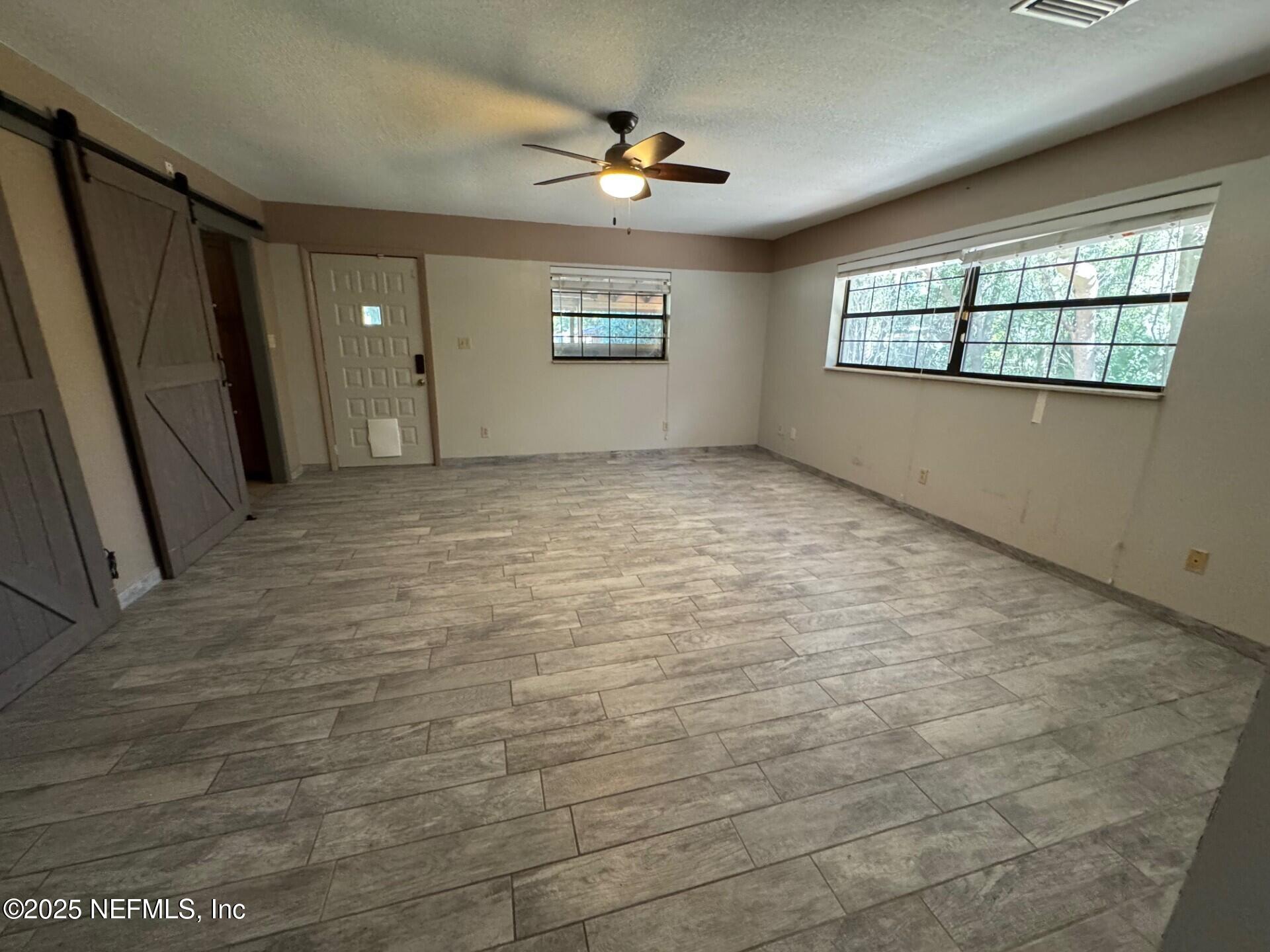 229 Davis Lake Road Palatka, FL 32177 - Photo 21 of 73 a view of an empty room with a window