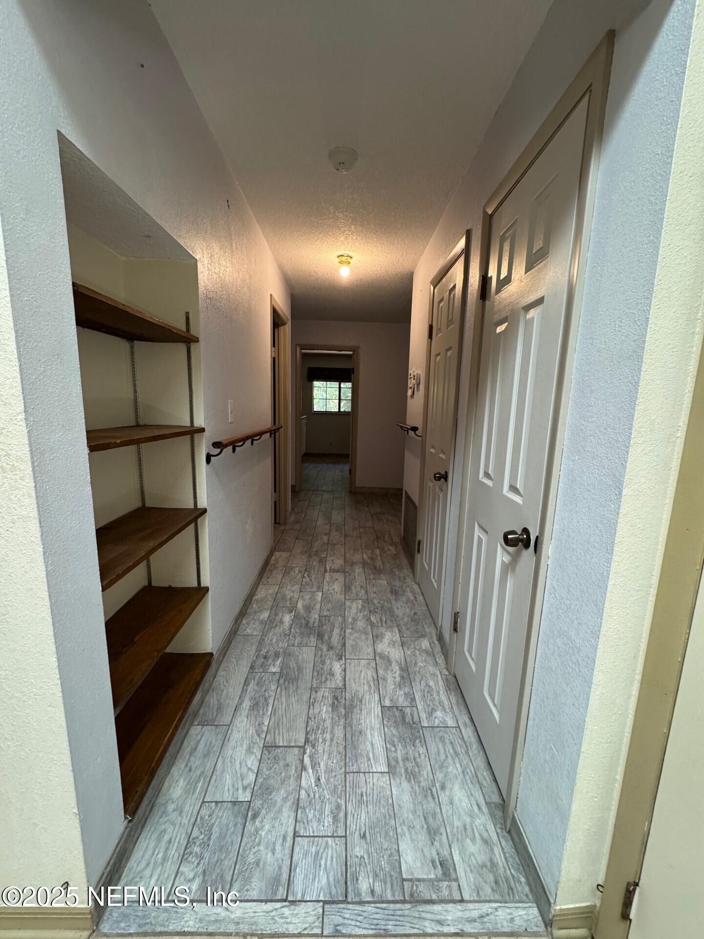 229 Davis Lake Road Palatka, FL 32177 - Photo 32 of 73 a view of gallery with wooden floor