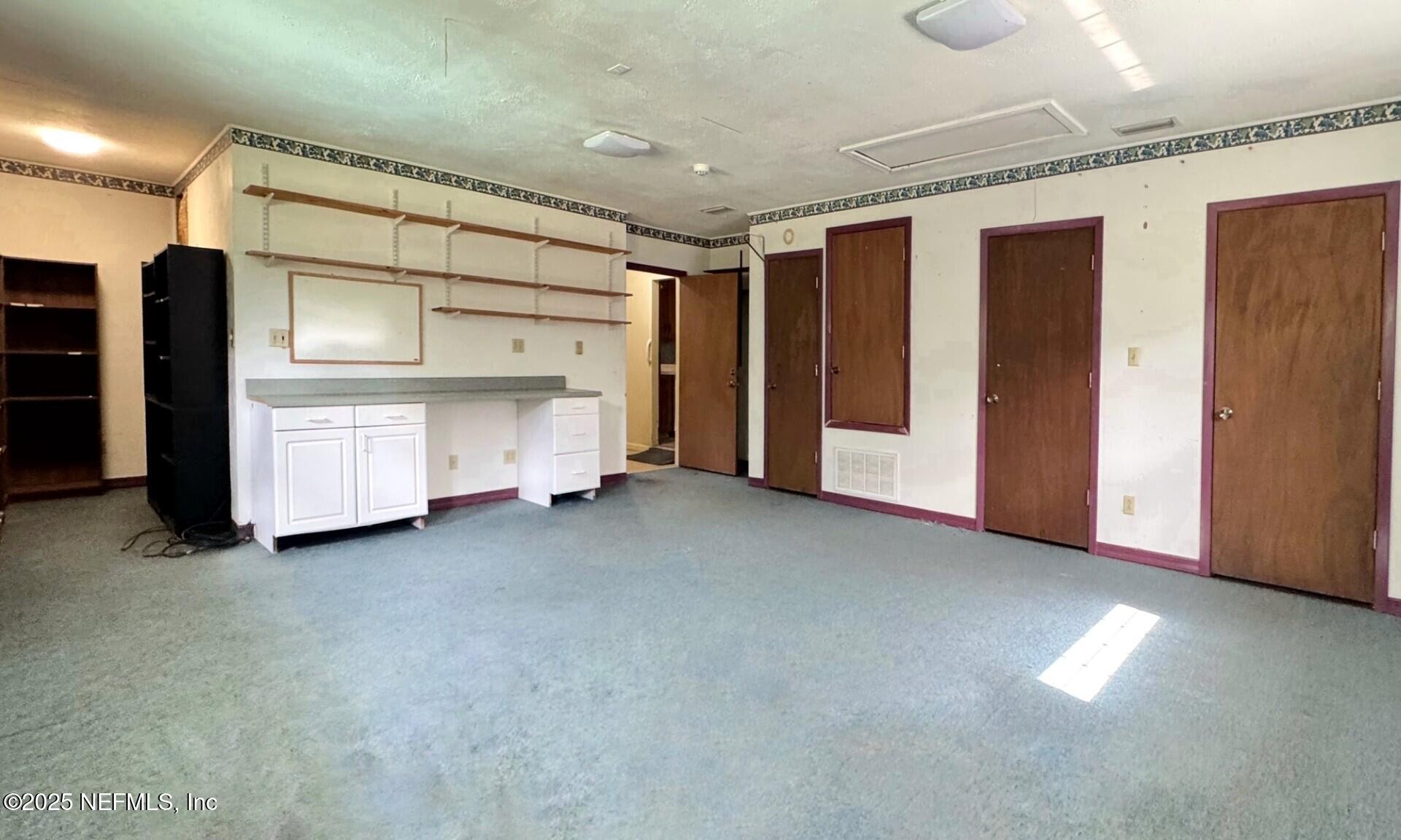 229 Davis Lake Road Palatka, FL 32177 - Photo 33 of 73 a view of an empty room with furniture and storage