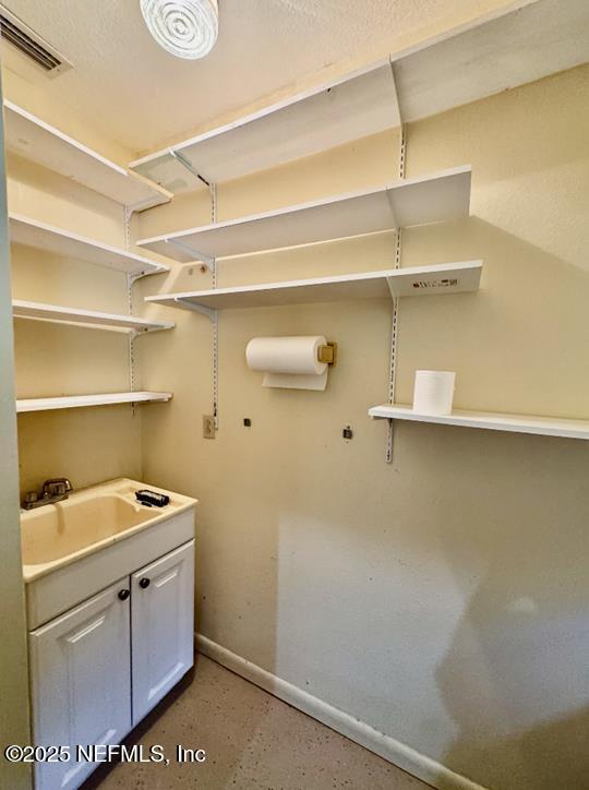 229 Davis Lake Road Palatka, FL 32177 - Photo 38 of 73 a utility room with cabinets