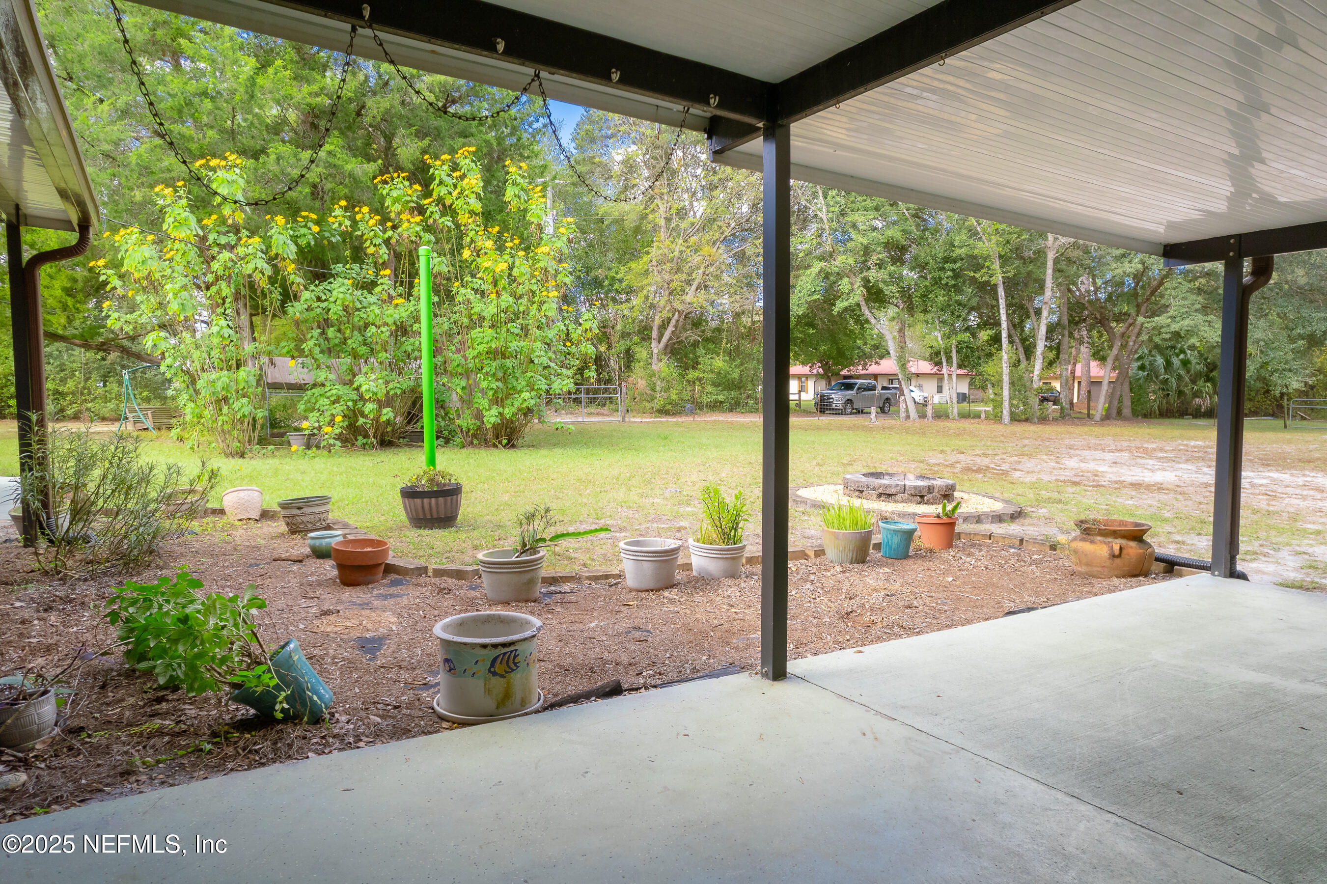 229 Davis Lake Road Palatka, FL 32177 - Photo 44 of 73 a view of a swimming pool with a patio
