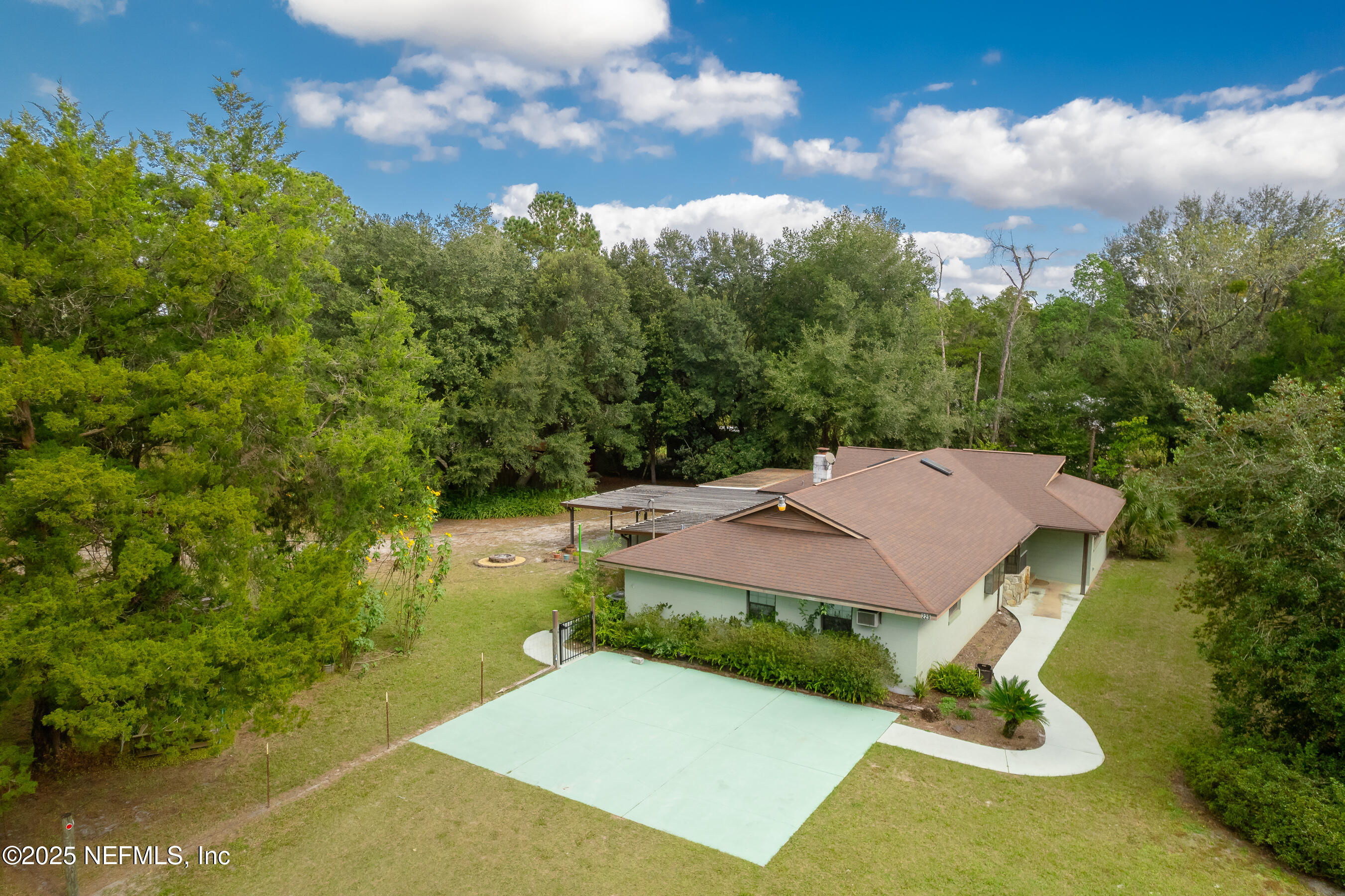 229 Davis Lake Road Palatka, FL 32177 - Photo 60 of 73 an aerial view of a house with swimming pool and garden