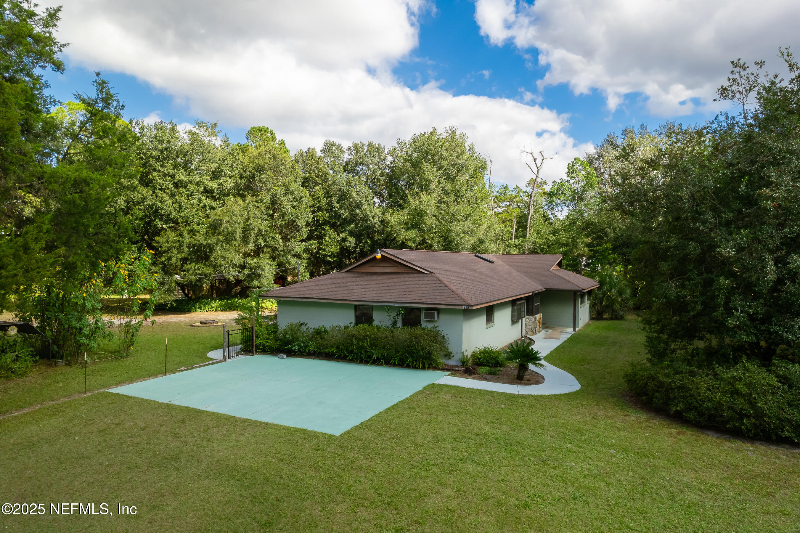 229 Davis Lake Road Palatka, FL 32177 - Photo 61 of 73 a view of a house with a yard