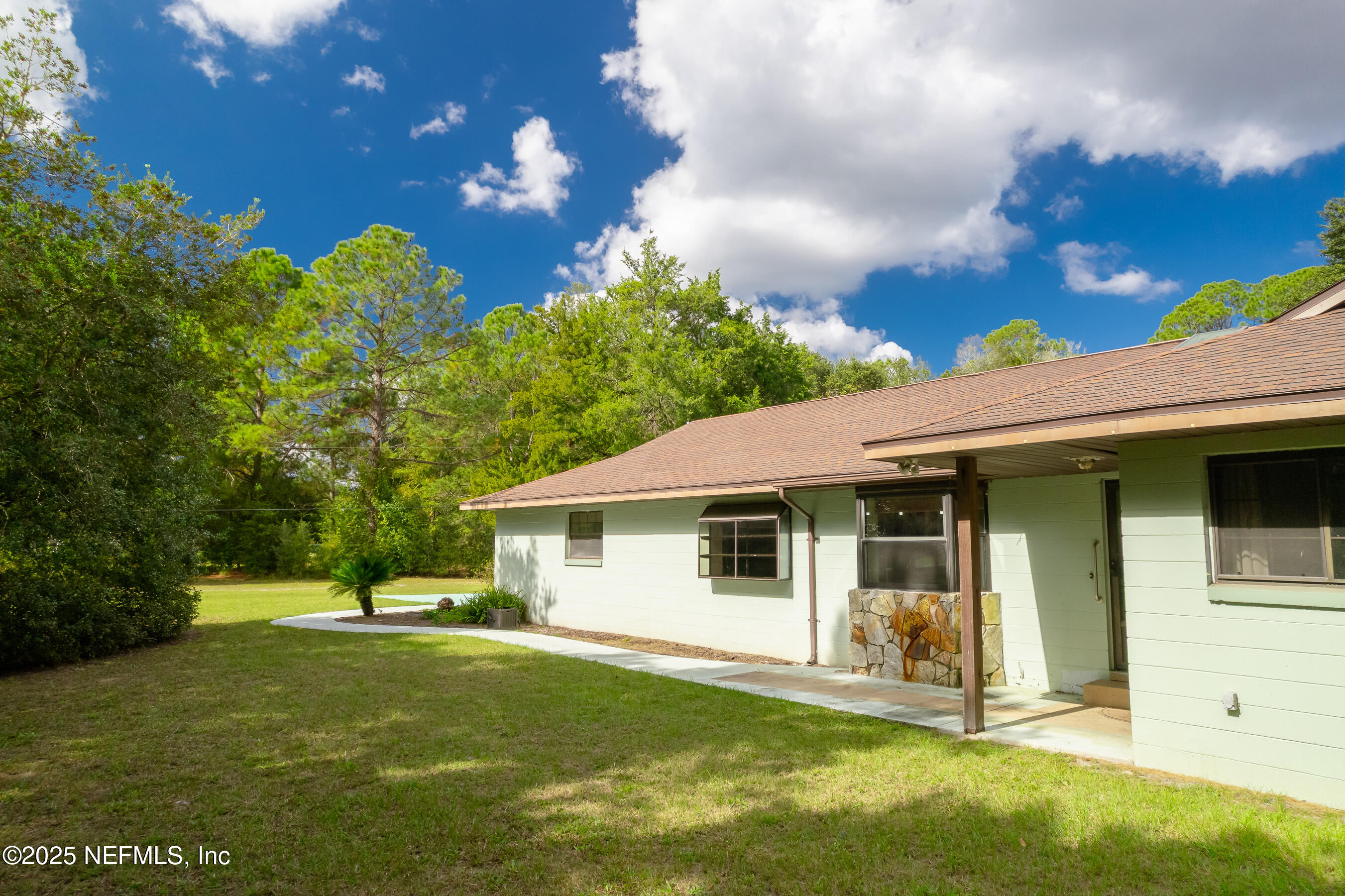 229 Davis Lake Road Palatka, FL 32177 - Photo 64 of 73 a view of a house with a backyard