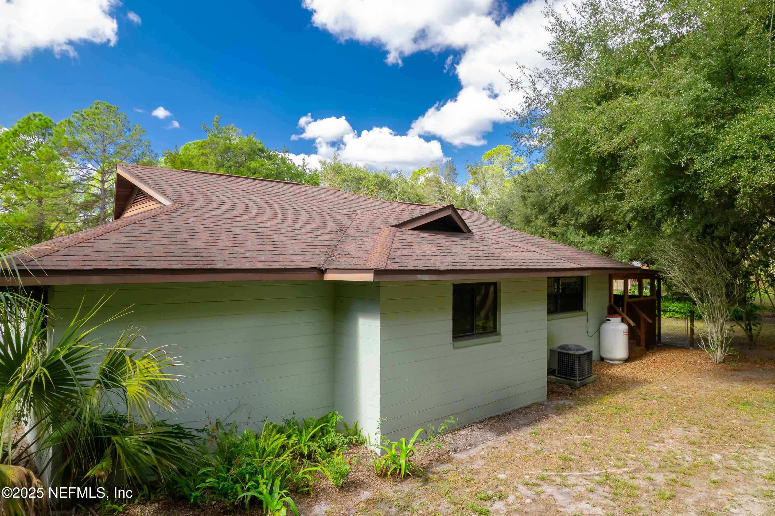229 Davis Lake Road Palatka, FL 32177 - Photo 65 of 73 a view of a house with a yard