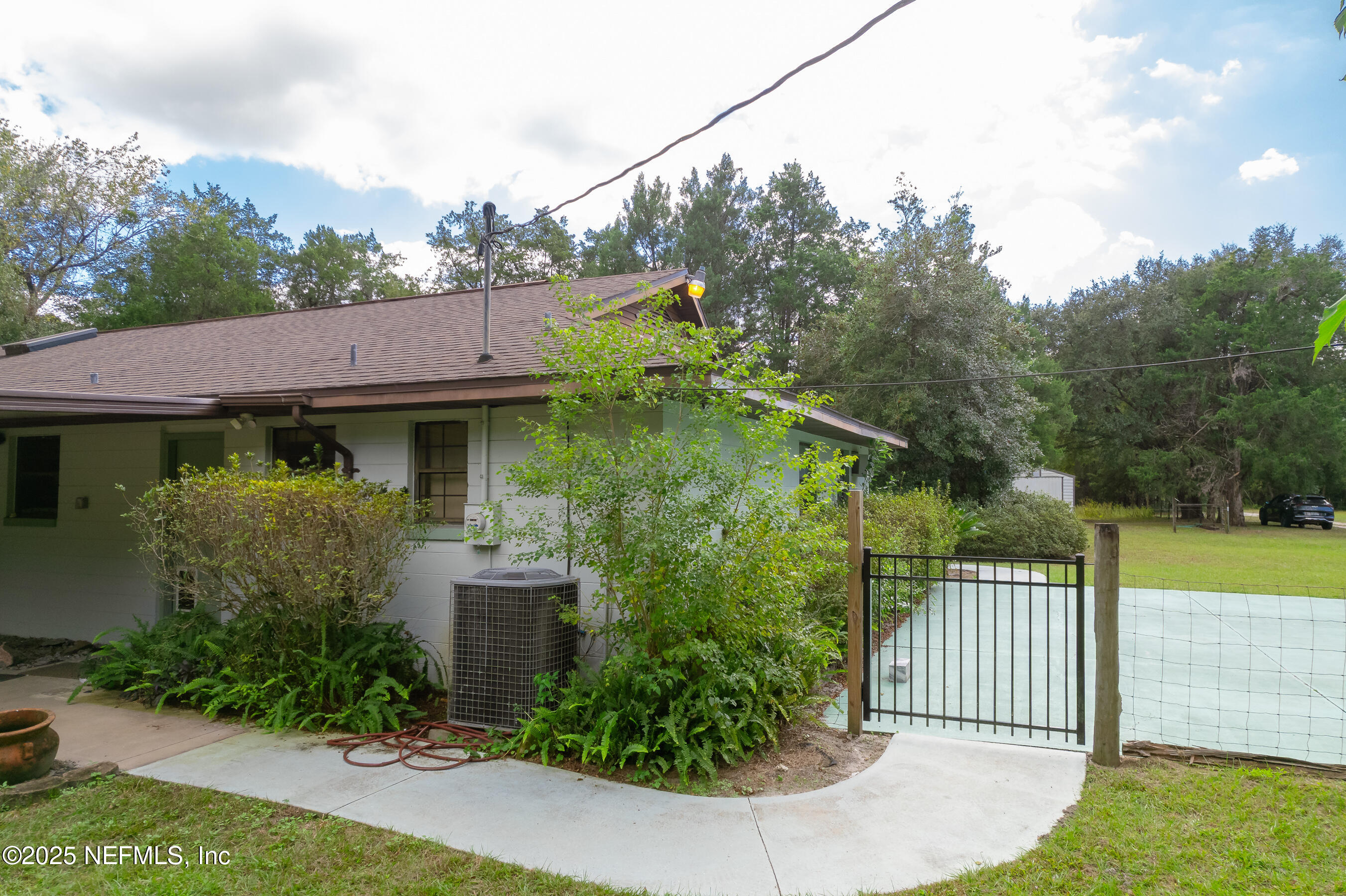 229 Davis Lake Road Palatka, FL 32177 - Photo 68 of 73 a front view of a house with garden