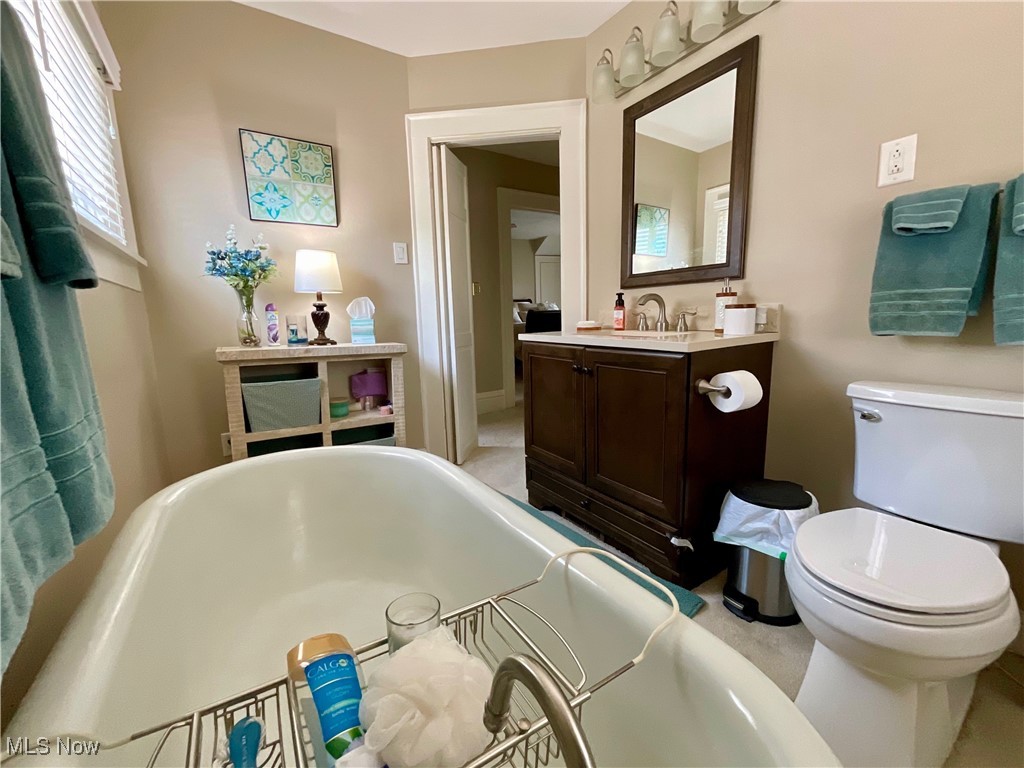 904 Chalker Street Akron, OH 44310 - Photo 14 of 28 Bathroom featuring a soaking tub and vanity