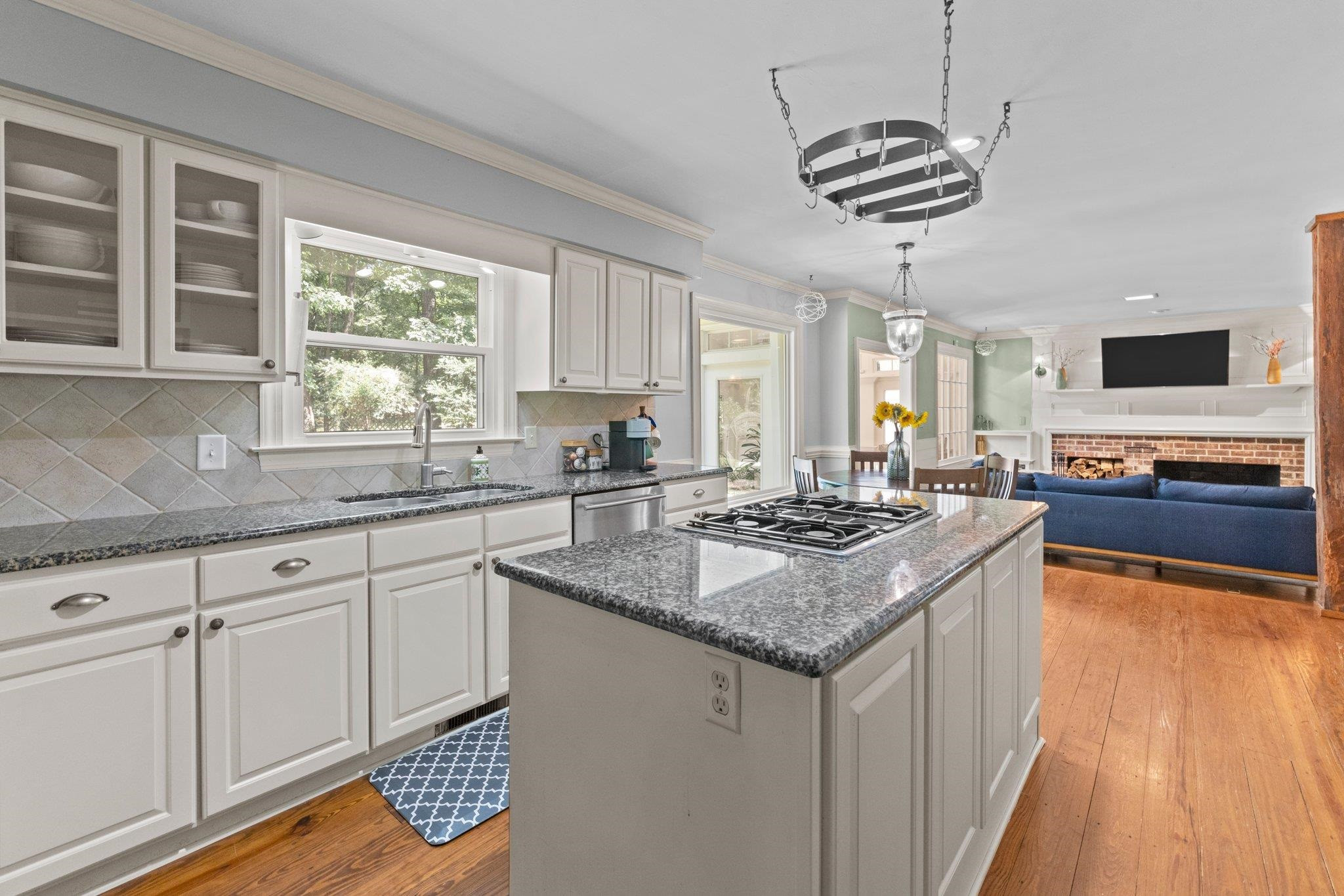 Stainless steel appliances in Kitchen include wall convection oven, microwave, and dishwasher. Kitchen