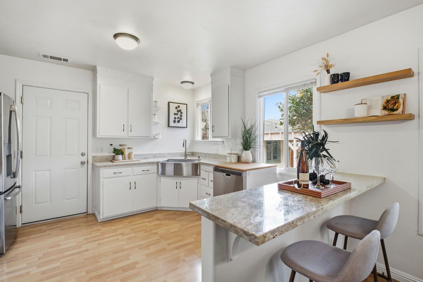 76 Georgia Way San Leandro, CA 94577 - Photo 11 of 32 a kitchen with a sink cabinets and wooden floor