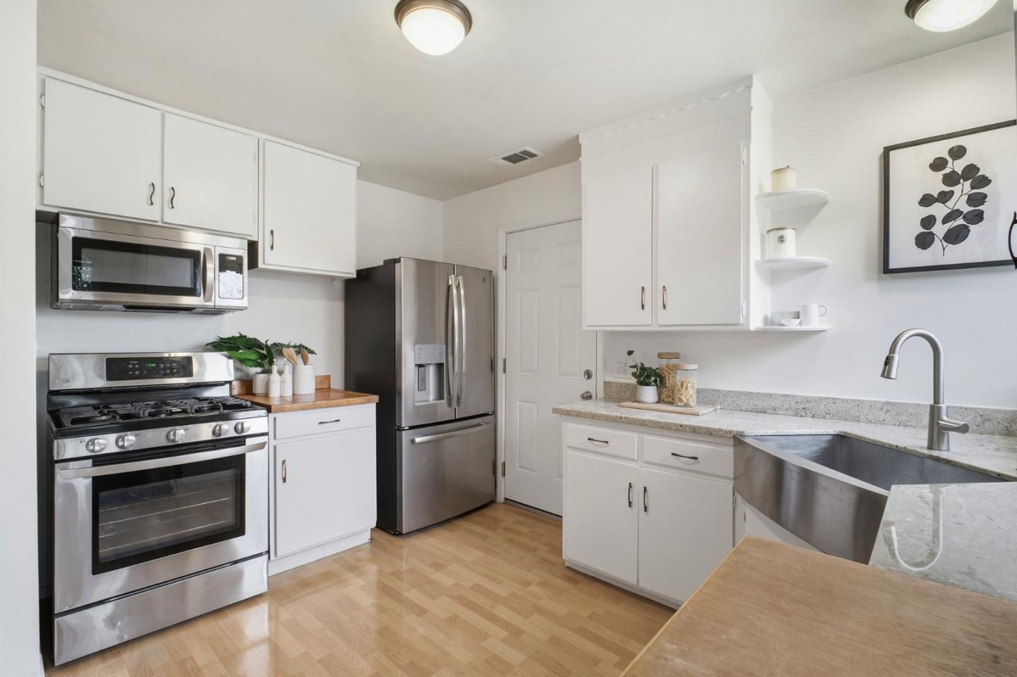 76 Georgia Way San Leandro, CA 94577 - Photo 13 of 32 a kitchen with cabinets stainless steel appliances and a counter space