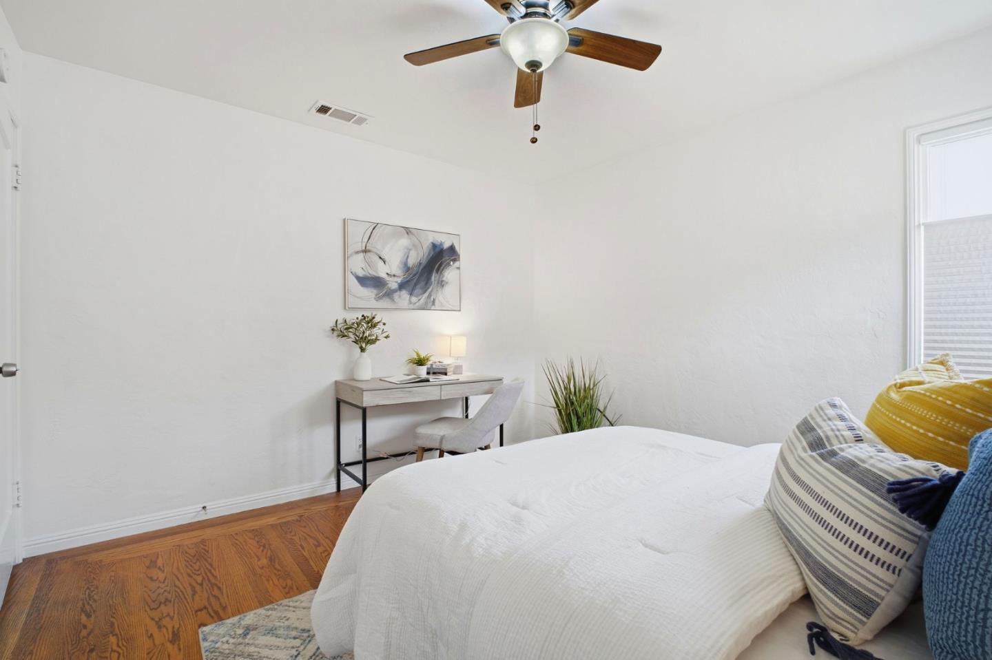 76 Georgia Way San Leandro, CA 94577 - Photo 22 of 32 a bedroom with a bed and a chair