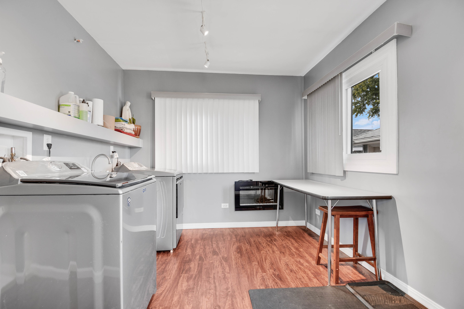 7828 Suburban Lane Bridgeview, IL 60455 - Photo 14 of 20 a kitchen with stainless steel appliances granite countertop a stove and a wooden floors