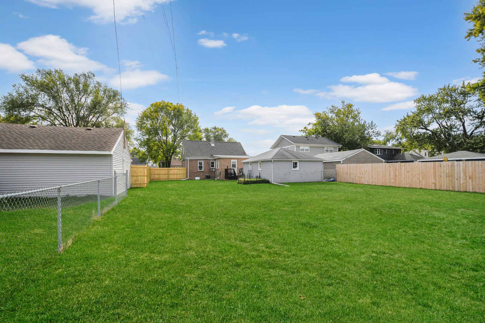 7828 Suburban Lane Bridgeview, IL 60455 - Photo 19 of 20 a view of a house with a back yard