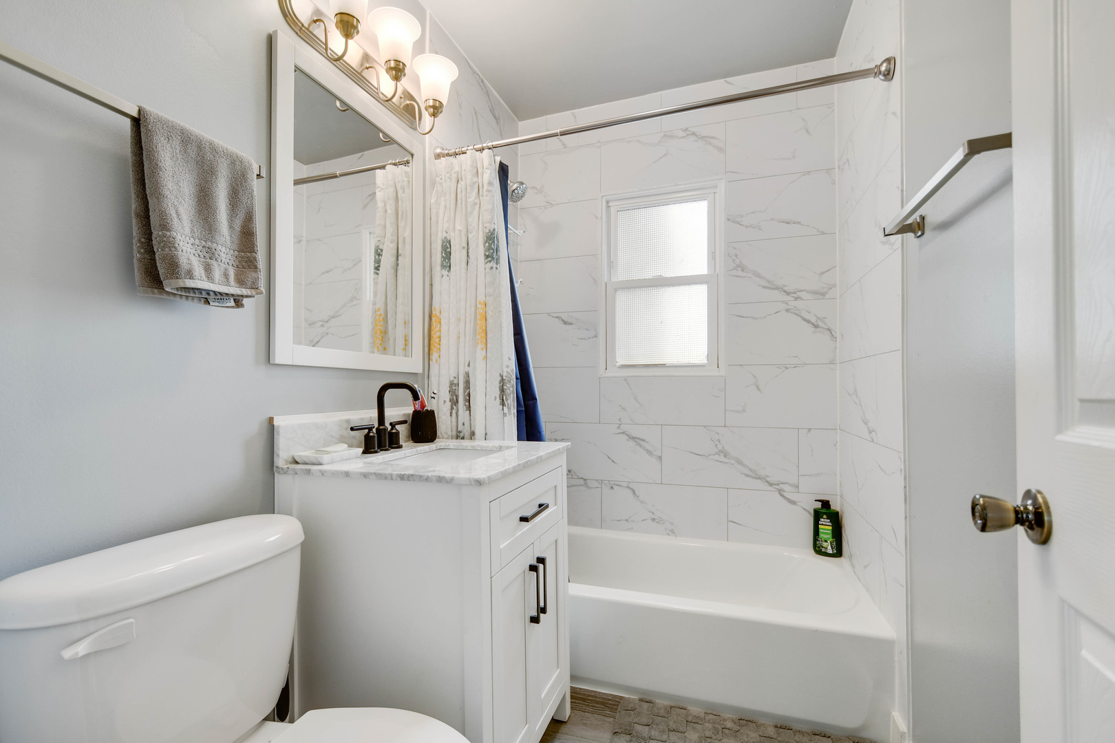 7828 Suburban Lane Bridgeview, IL 60455 - Photo 10 of 20 a bathroom with a sink a toilet and a bathtub