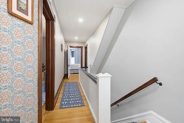 a view of a bathroom from a hallway