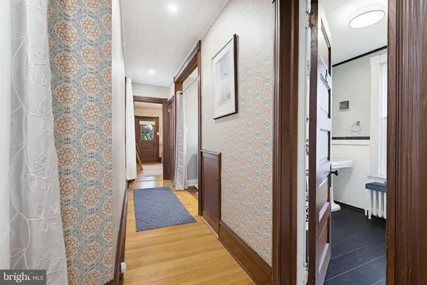 a bathroom with a toilet a sink and tub
