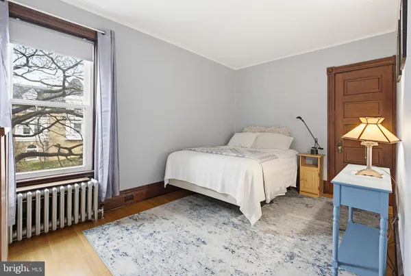 a bedroom with a bed and a closet