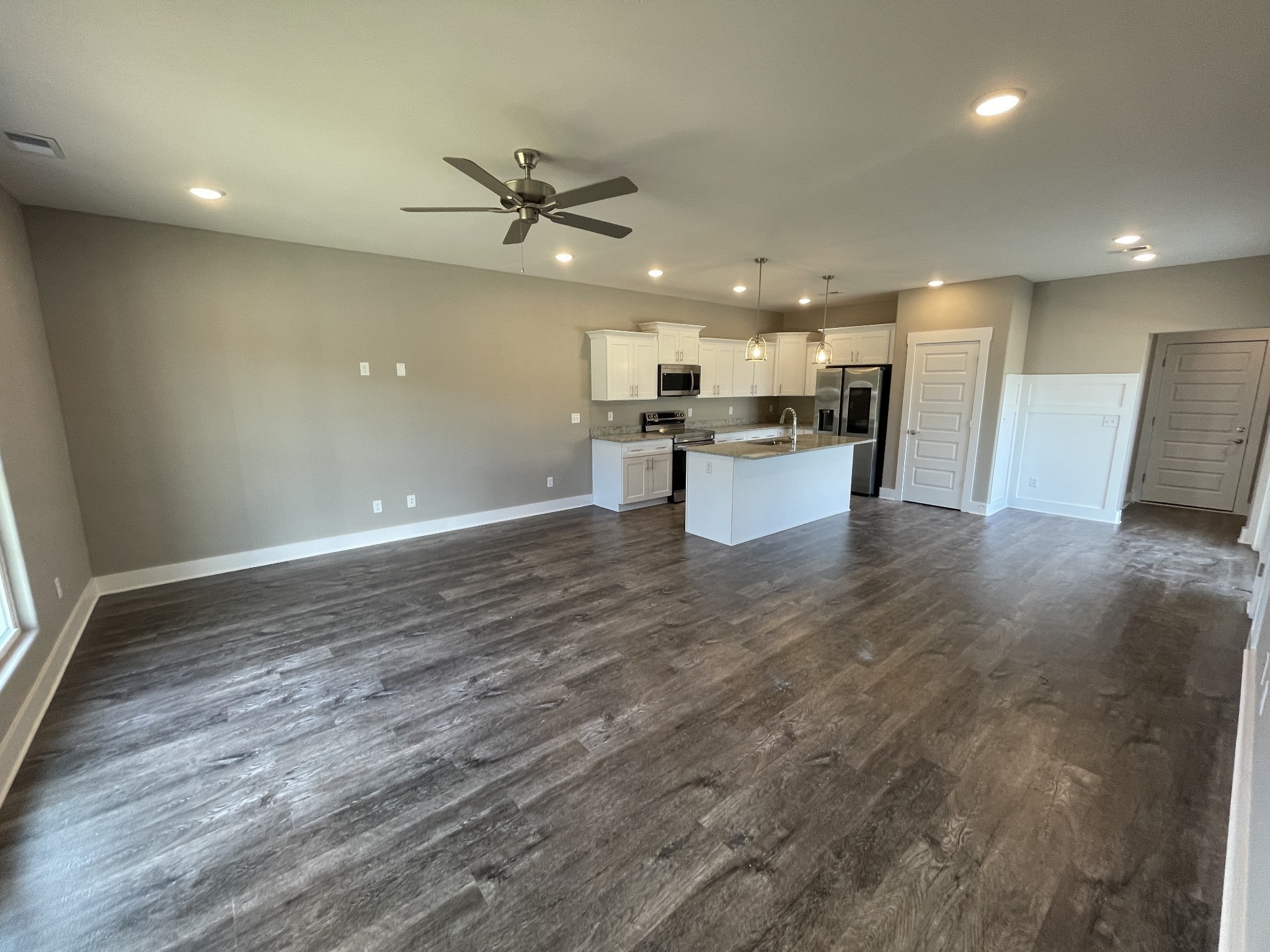 2114 Barringer Lane Murfreesboro, TN 37128 - Photo 3 of 17 a view of a kitchen with kitchen island a counter top space stainless steel appliances and a ceiling fan