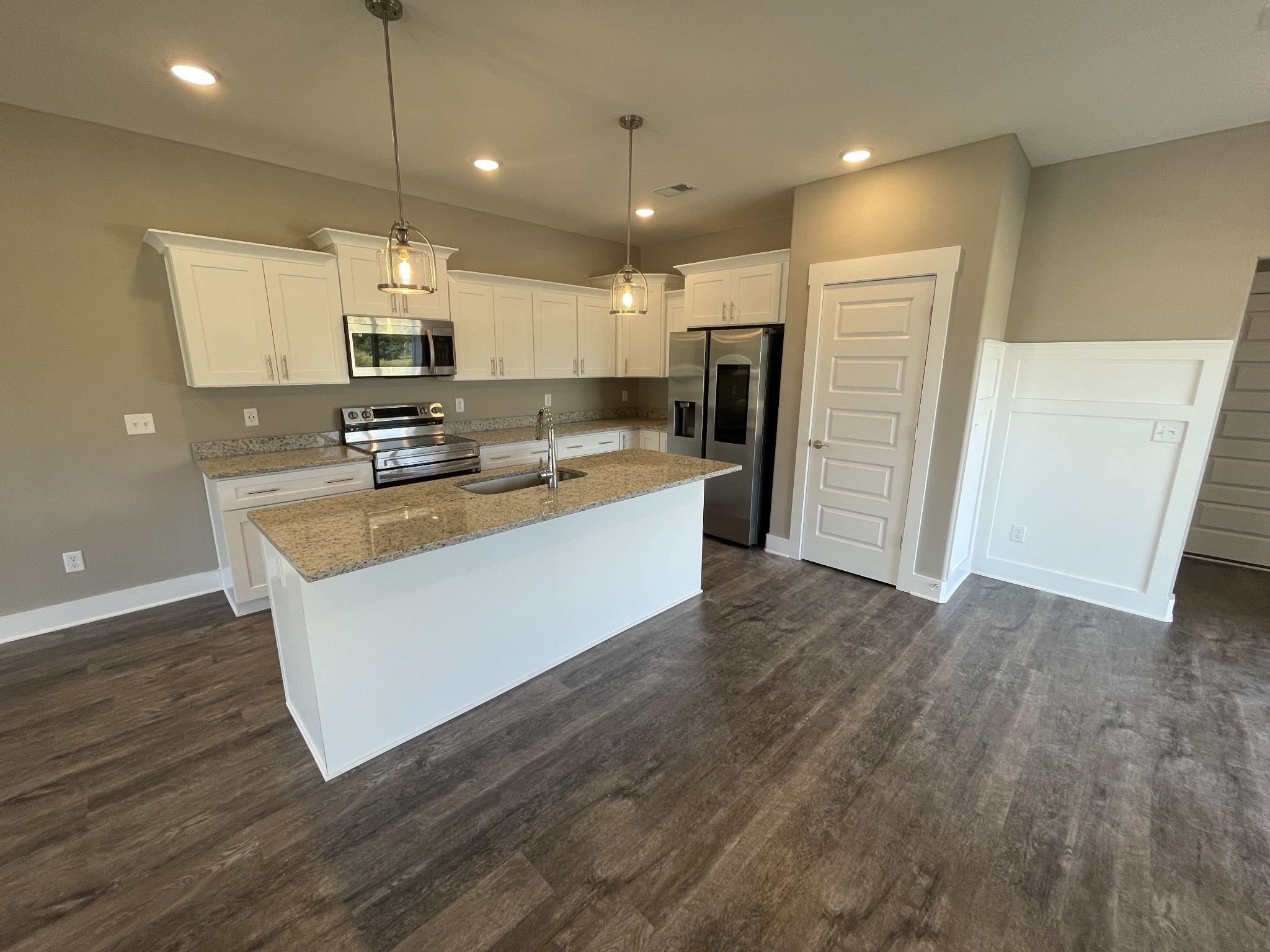 2114 Barringer Lane Murfreesboro, TN 37128 - Photo 5 of 17 a large kitchen with stainless steel appliances a large counter top a sink a refrigerator and a window